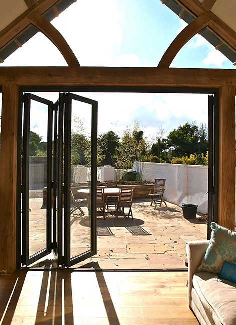 Bi-fold door set installed in a timber-framed extension opening