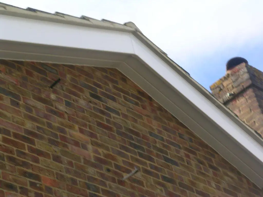 Gable-end roofline finish installed on a brick property