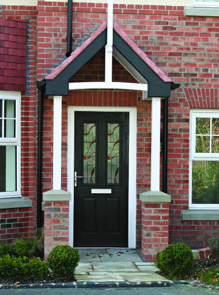 Red composite-style front door with decorative glass details