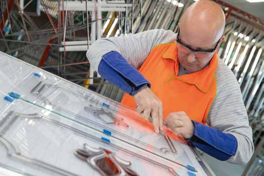 Patterned door glazing panel in a white frame installation
