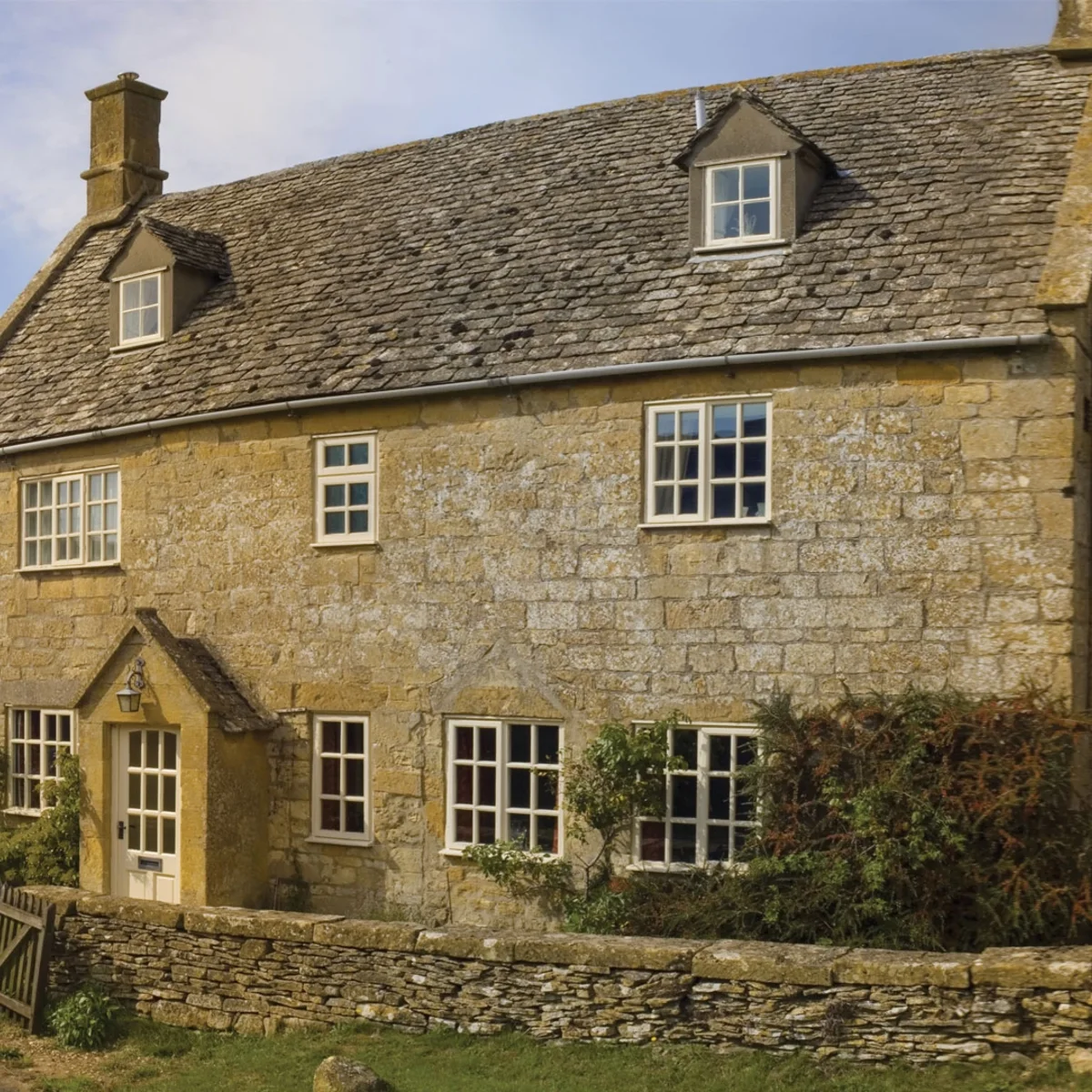 Timber double glazed windows on a traditional house front
