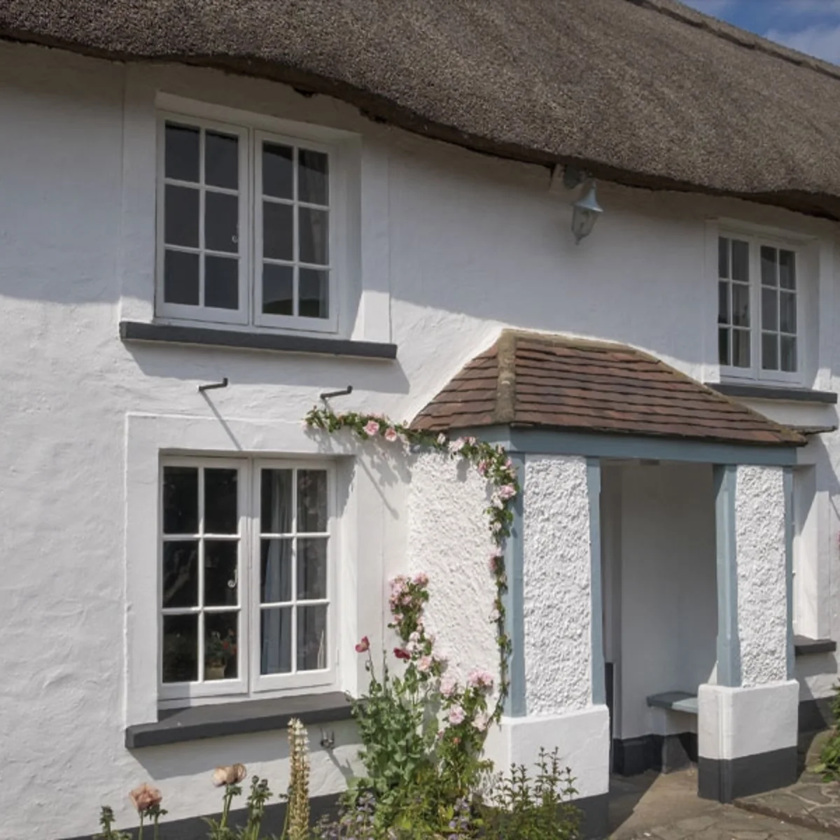 Timber storm casement window fitted on a cottage-style home