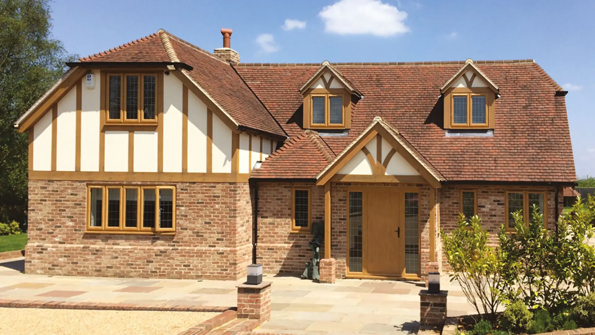 Woodgrain-effect window finish shown on a traditional style home