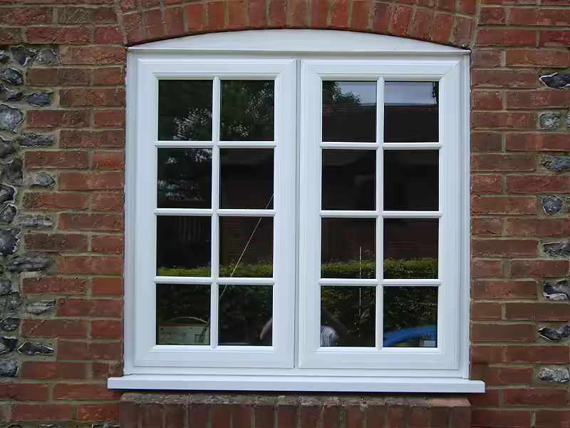 White casement window installation with decorative glazing bars